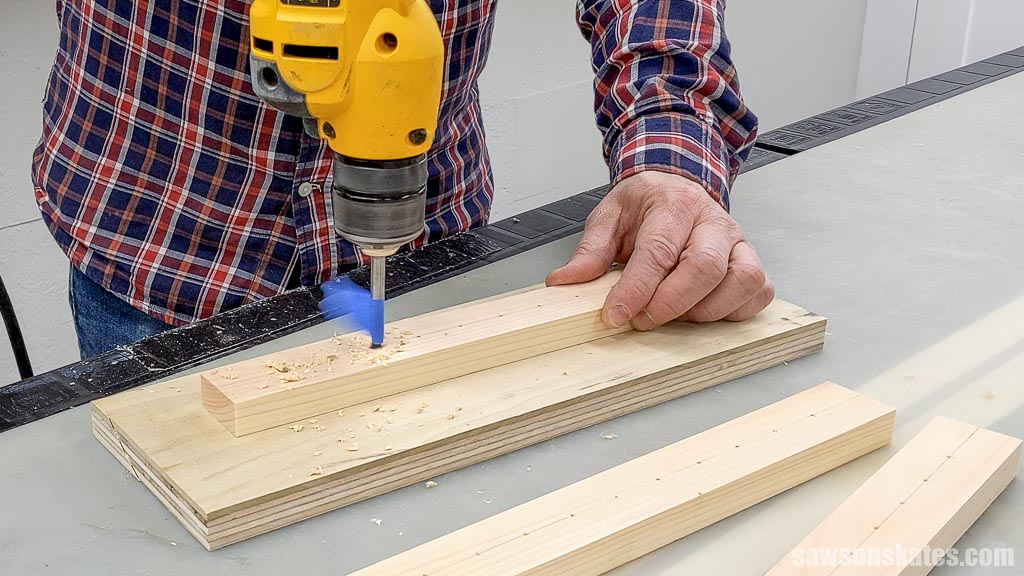 Drilling holes for router bits in a DIY router bit organizer's shelf
