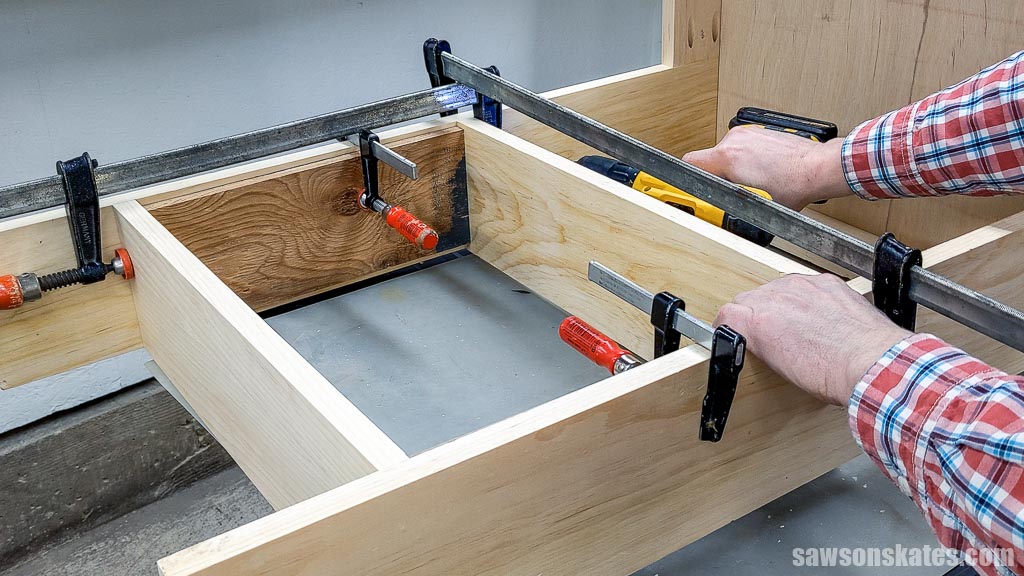 Attaching the lower tray bottom on a DIY air compressor cart