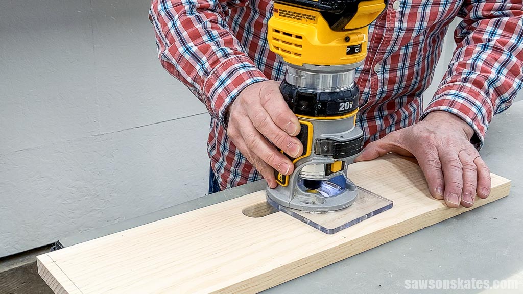 Smoothing the edges of a handle opening with router and roundover bit