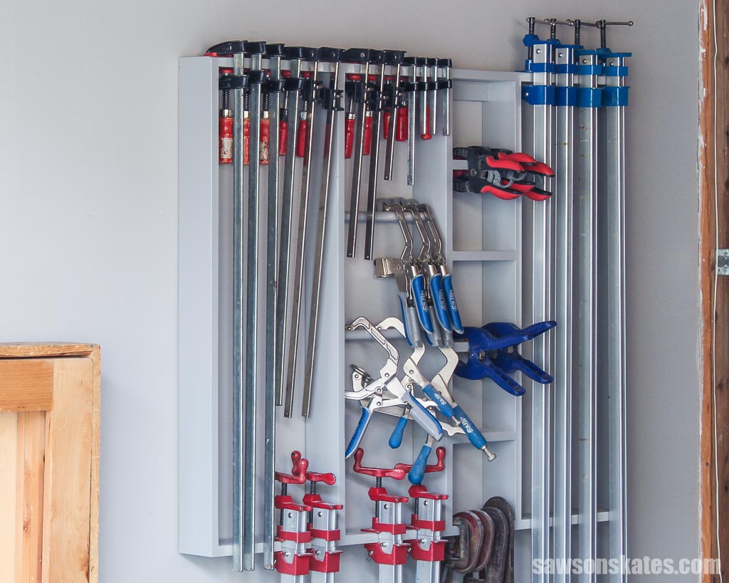DIY wall-mounted clamp rack with bar, spring and C clamps