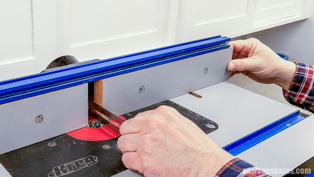 Using a ruler to create clearance between a router bit and a router table's fence