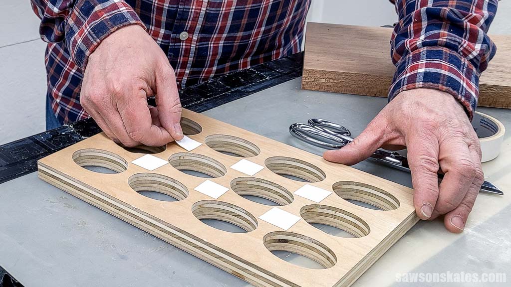 Applying doubled sided tape to a DIY deviled egg tray's template