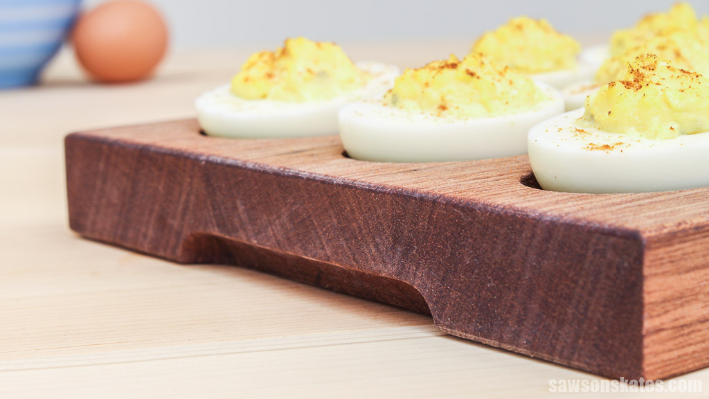 Closeup of a handmade deviled egg carrier's recessed handle