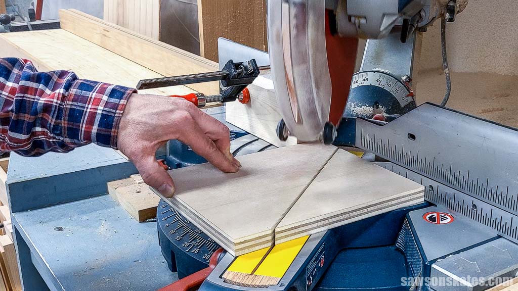 Using a miter saw to cut the angle on the side of a DIY French cleat tool shelf