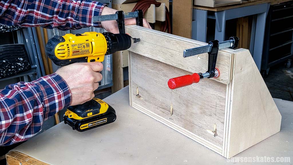 Drilling a pilot hole in a French cleat for a tool storage shelf