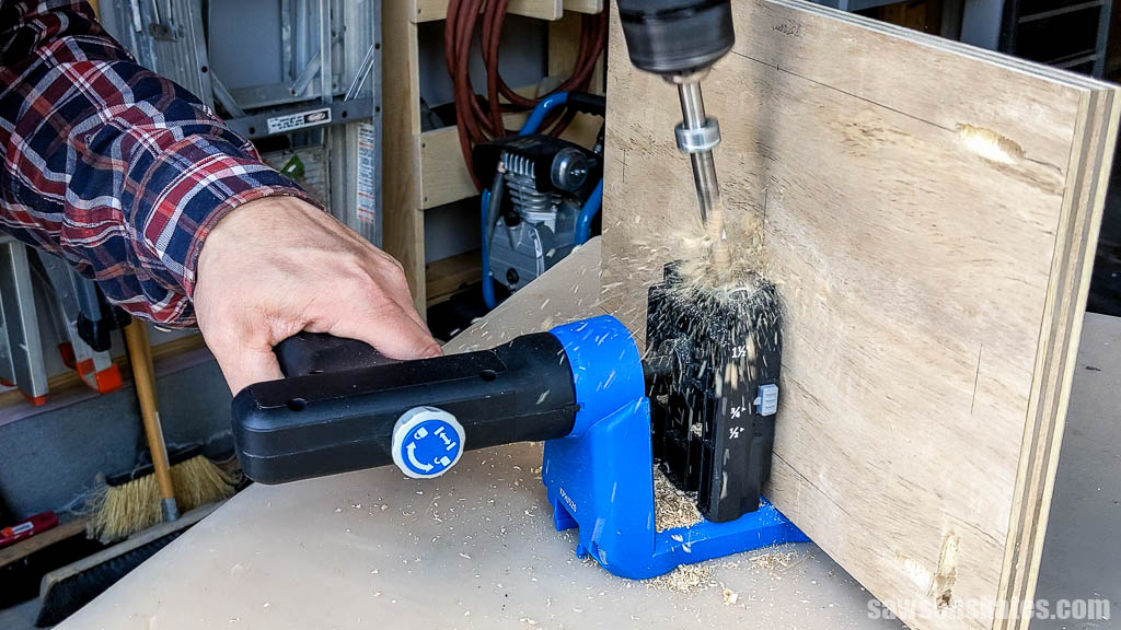 Using a pocket hole jig to drill pocket holes in the back of a DIY French cleat tool shelf