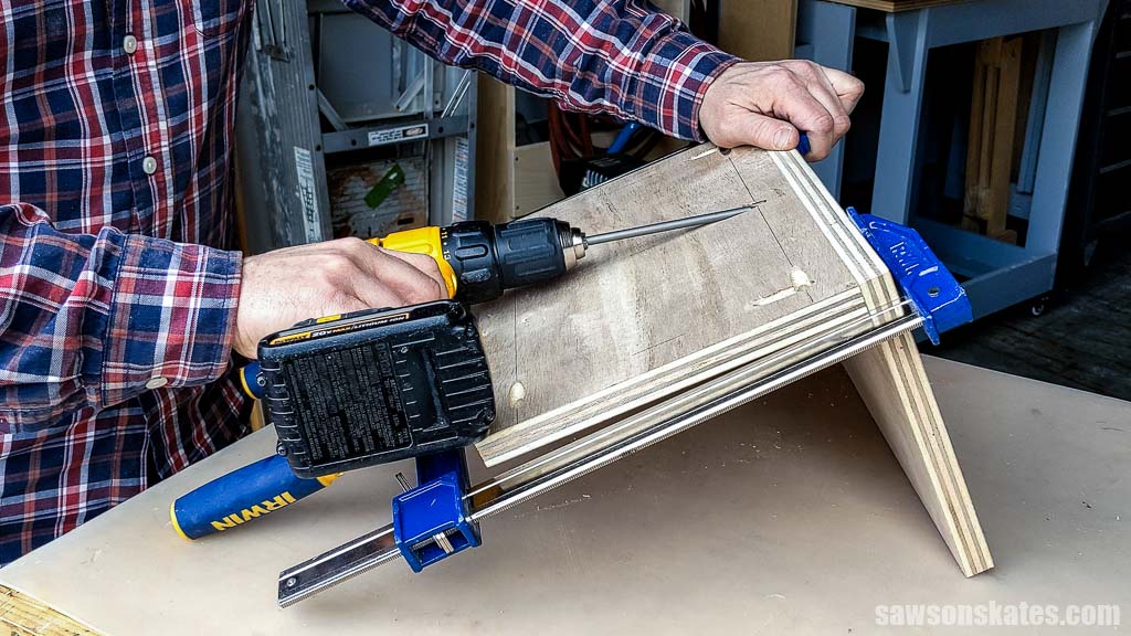 Attaching the back to the bottom of a tool storage shelf using pocket hole screws