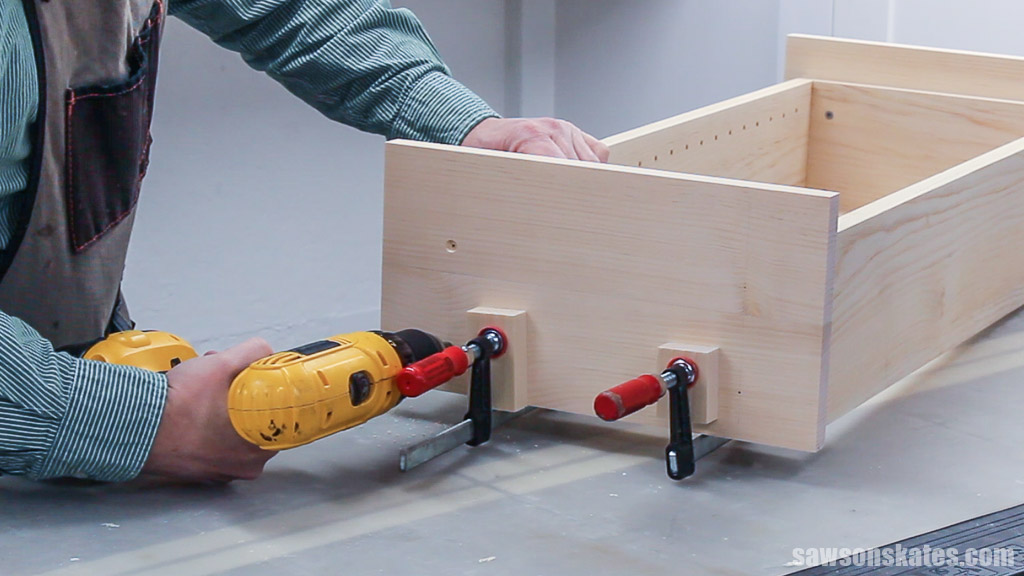 Drilling countersink holes in the bottom of a DIY wall-mounted spice rack