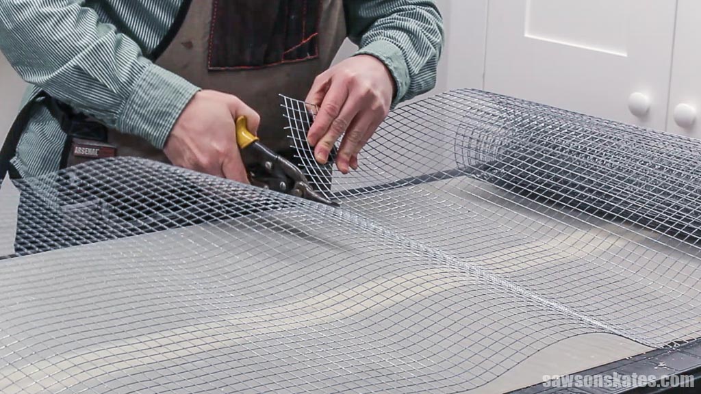 Using tin snips to cut hardware cloth