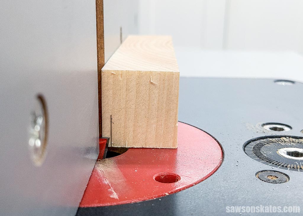 Positioning a raised trivet's foot against a dovetail bit in a router table