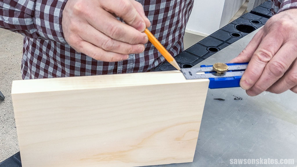 Marking the location for a dovetail socket in the top of a DIY hot pad with feet