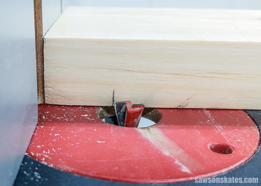 Positioning a pedestal-style trivet's top against a dovetail bit in a router table