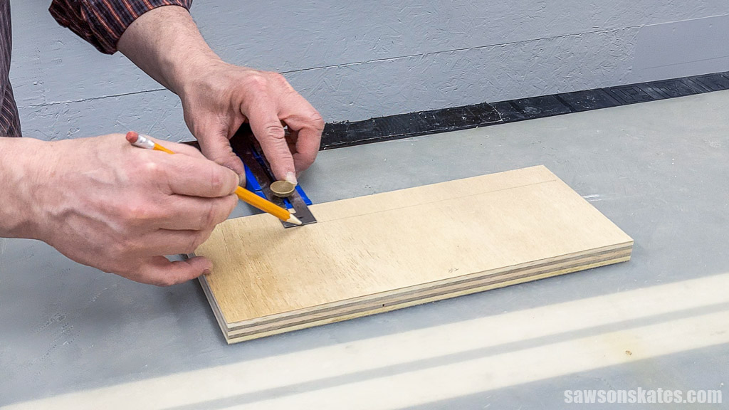 Using a pencil to mark the locations for pocket holes