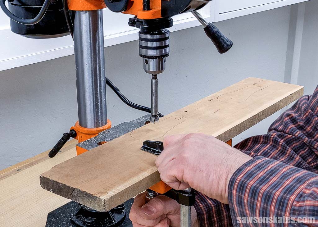 Clamping a board to a drill press table
