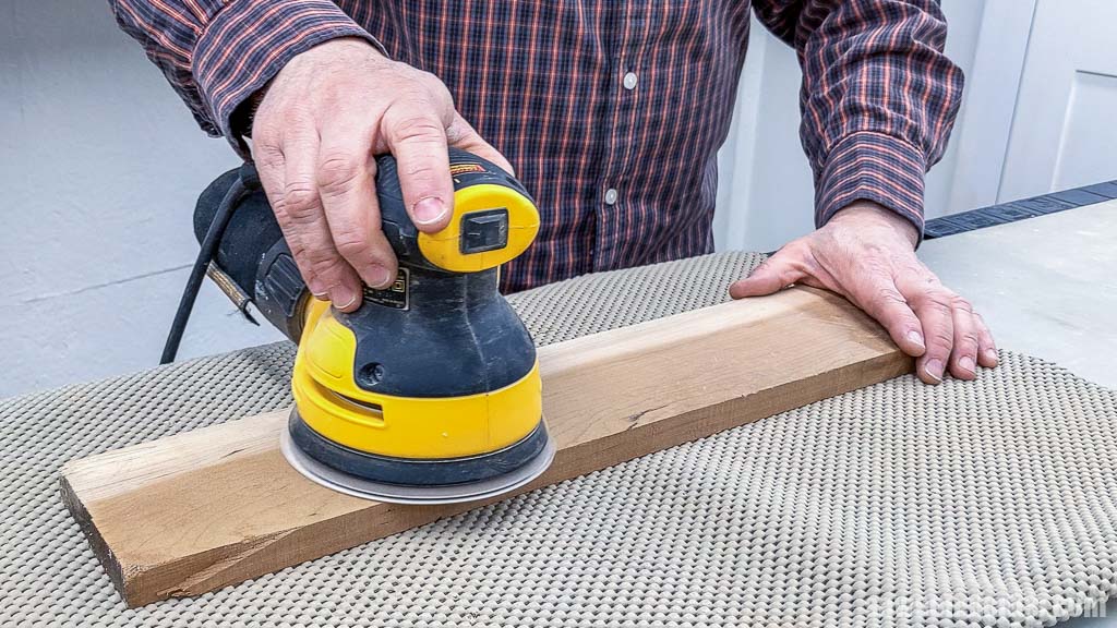 Smoothing wood with an orbital sander