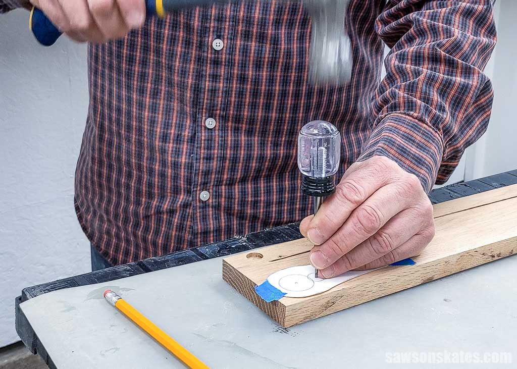Using an awl to make a starting point for a drill bit