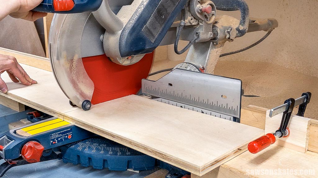 Cutting a piece of plywood to length using a miter saw