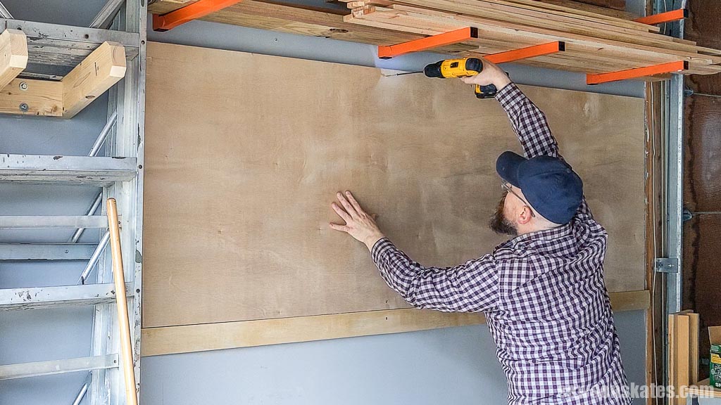 Attaching a plywood sheet to a garage wall