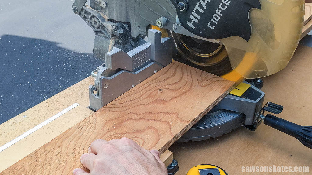 Cutting a plywood strip to length with a miter saw