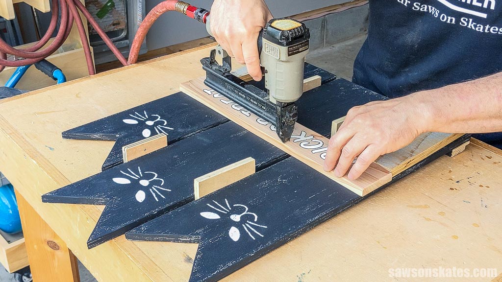 Attaching a trick-or-treat banner with a brad nailer