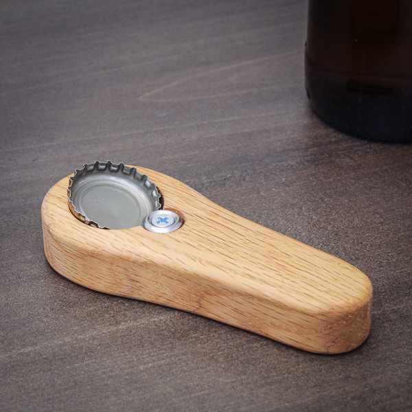 DIY wood handheld bottle opener on a table
