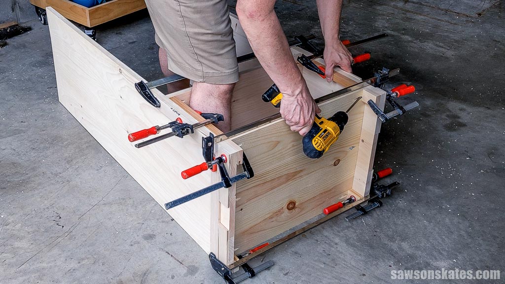 Attaching a shelf to a side panel with a drill