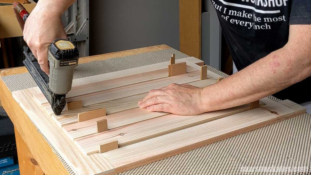 Attaching a slat with a brad nailer