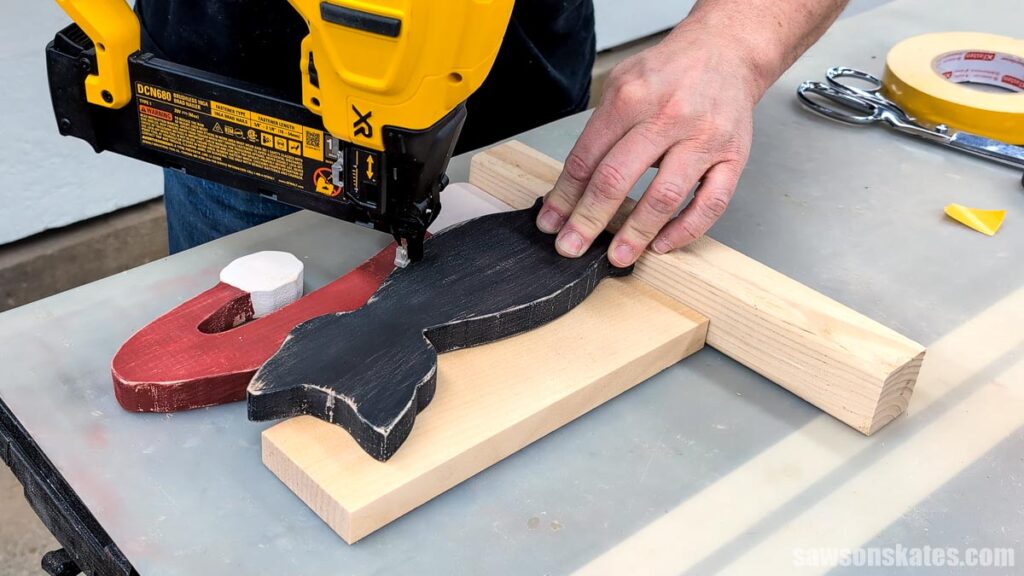 Tacking the cat to the hat with a brad nailer