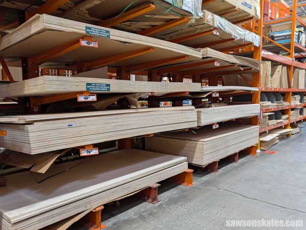 Stacks of plywood sheets sitting on a store's shelves