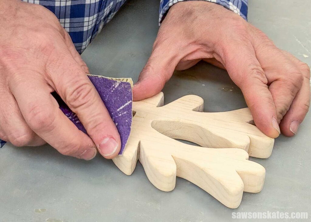 Scott sanding the reindeer's antlers