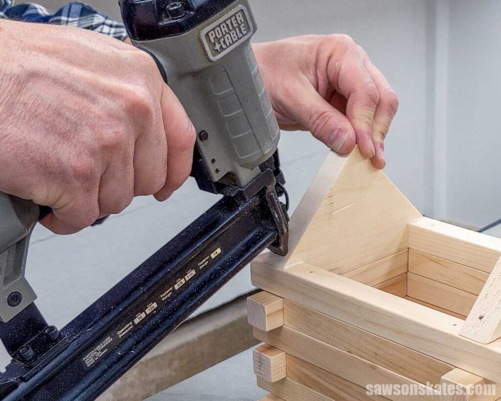 Attaching a gable to a birdhouse with a brad nailer