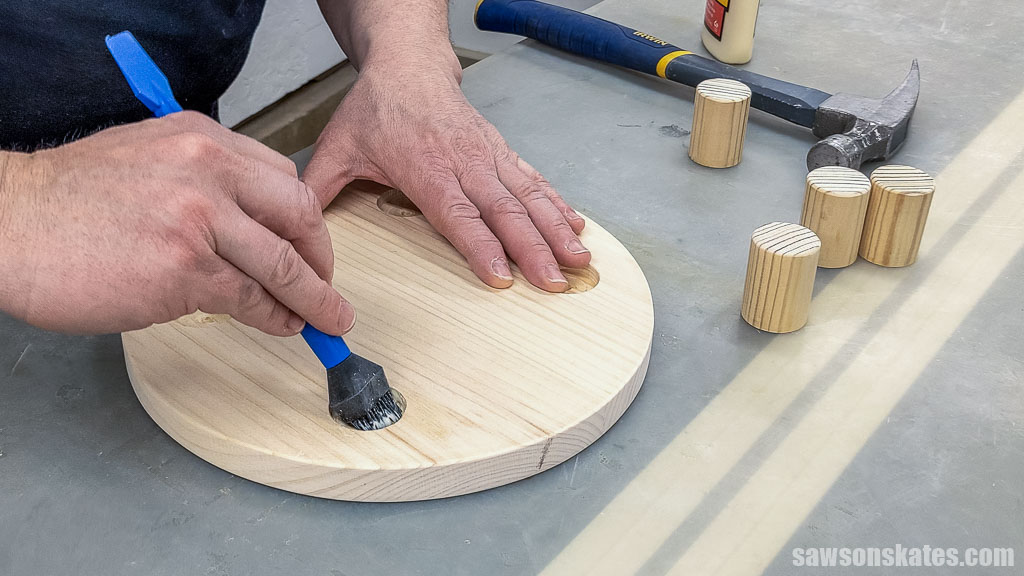 Applying glue to a hole with a silicone brush