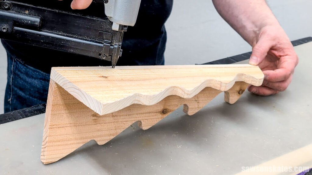 Attaching the second half of the tree to the first with a pin nailer