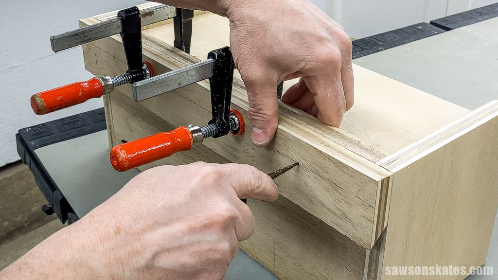 Using an awl to make a starting point