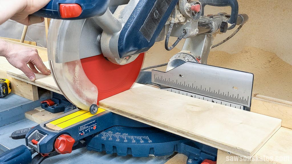 Cutting a board to length with a miter saw