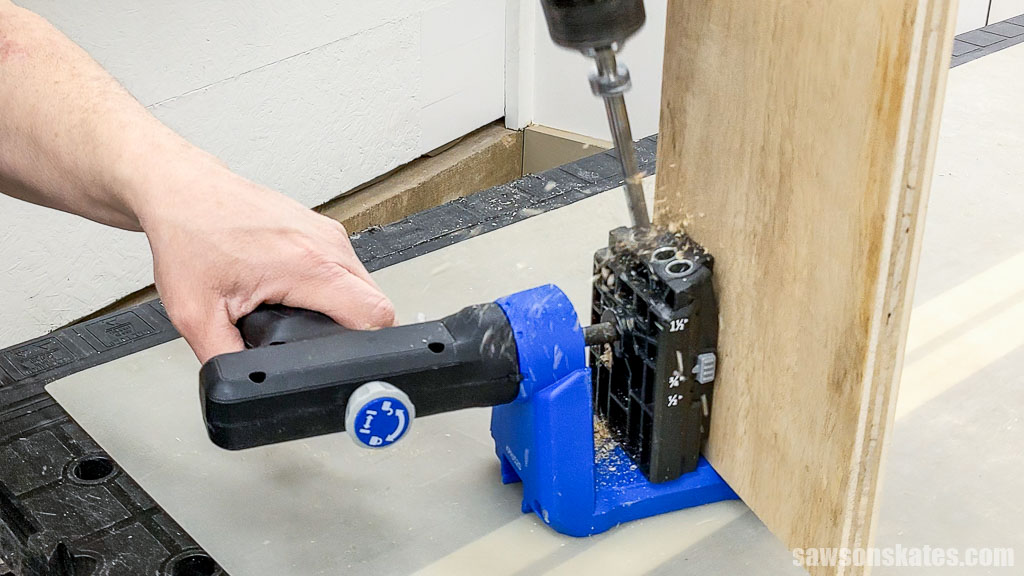 Using a pocket hole jig to drill pocket holes in a board