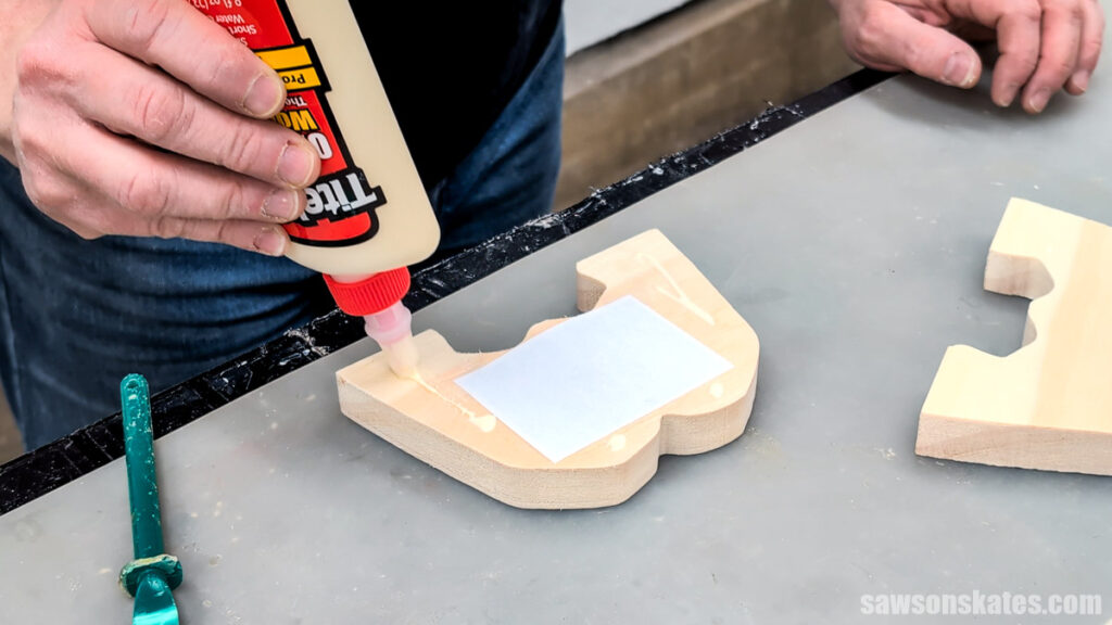 Applying glue to the back of the frame