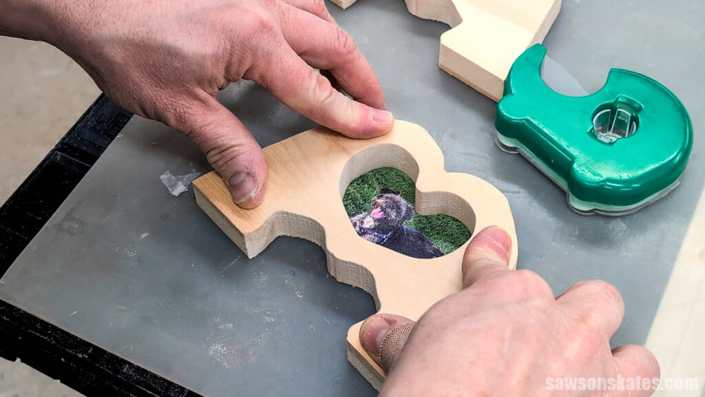 Pressing a wooden frame onto a photo