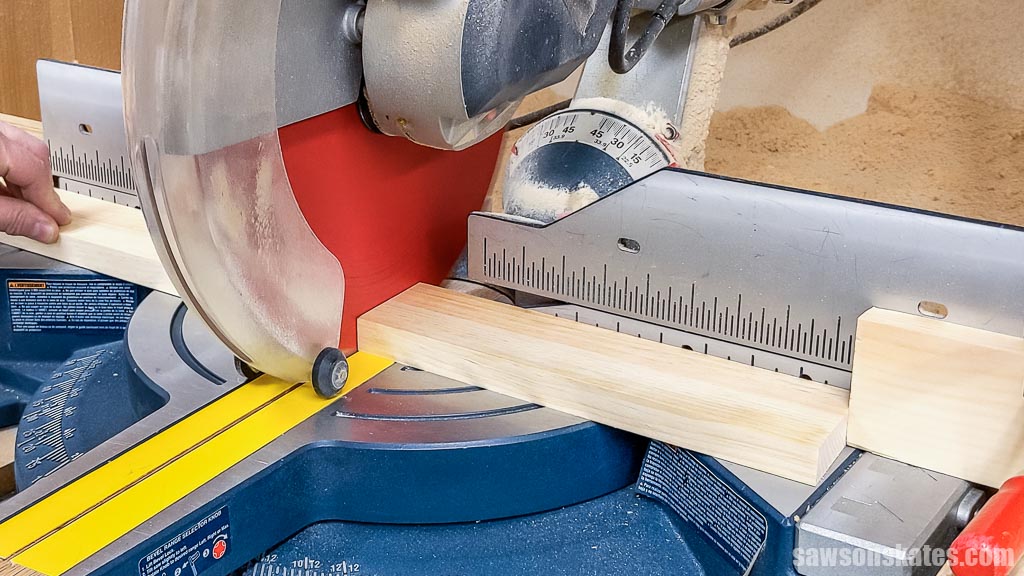 Cutting a board to length with a miter saw