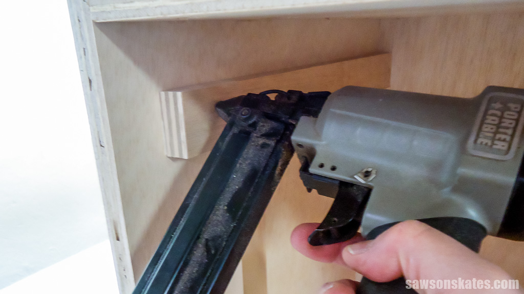 Attaching the top support with brad nails