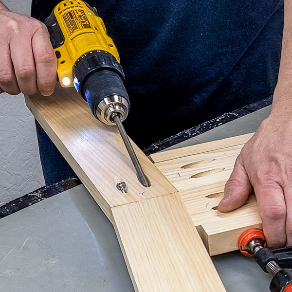 Scott using a drill to drill a pocket hole screw into a pocket hole
