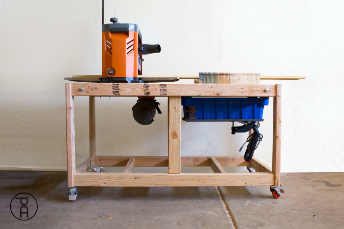 Flip top workbench with a planer on the left and Kreg Foreman on the right