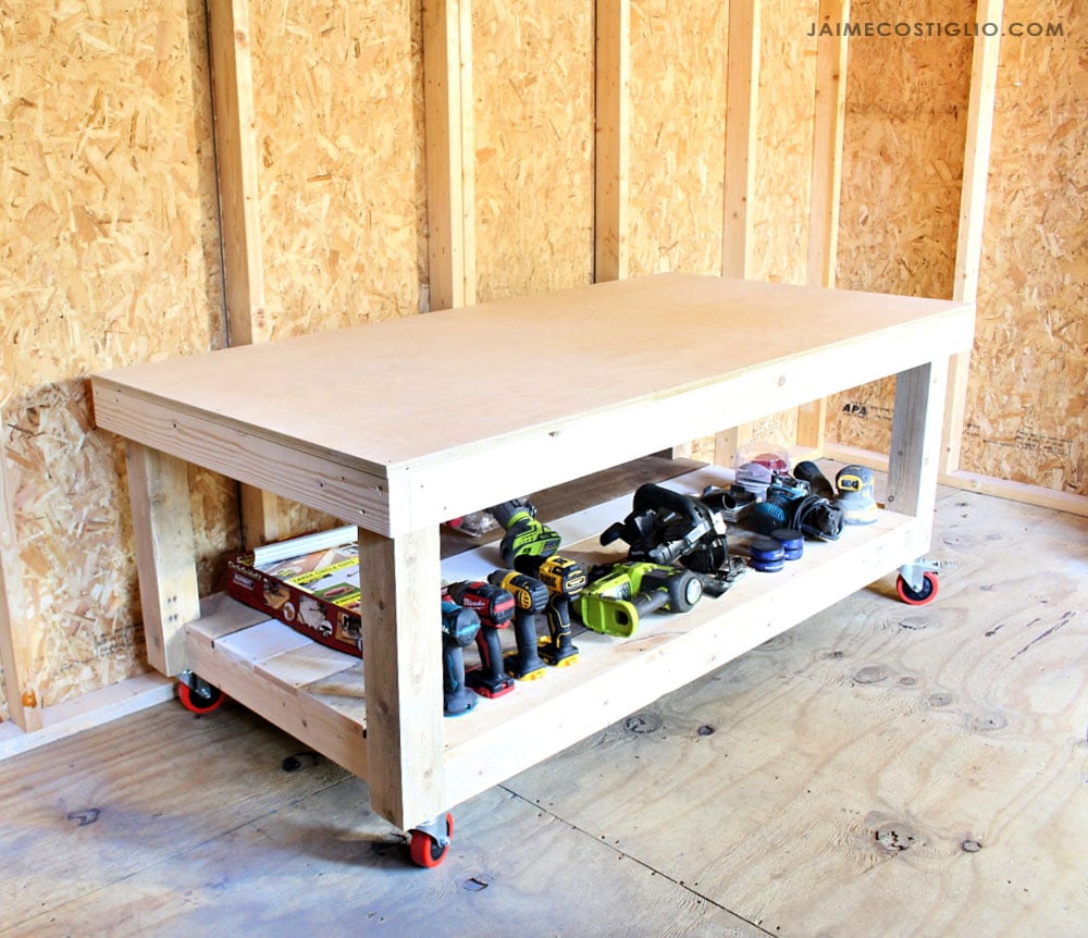 Large, low workbench with tools on the lower shelf