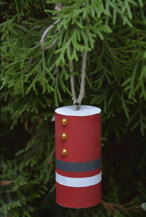 Wood dowel painted to look like Santa's outfit
