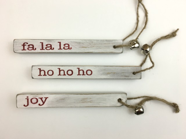 Wood blocks with the words fa la la, ho ho ho, and joy