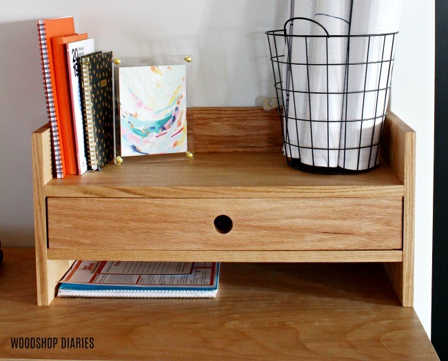 Desk organizer with a drawer in the middle and books above and below