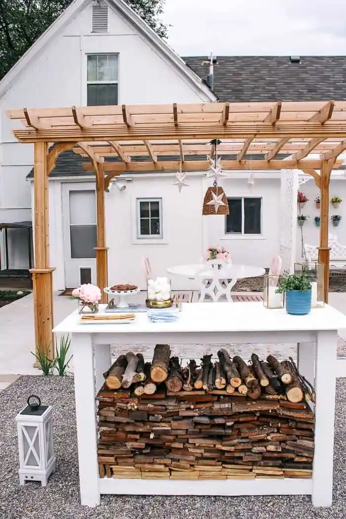 White-painted firewood holder on a patio