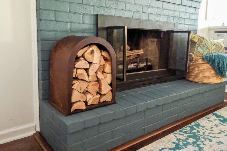 Uplcycled firewood rack next to a fireplace