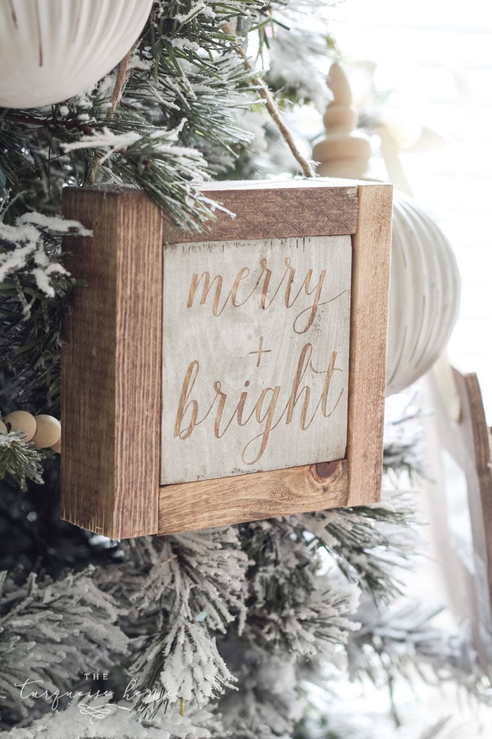 Wood framed block that says merry + bright