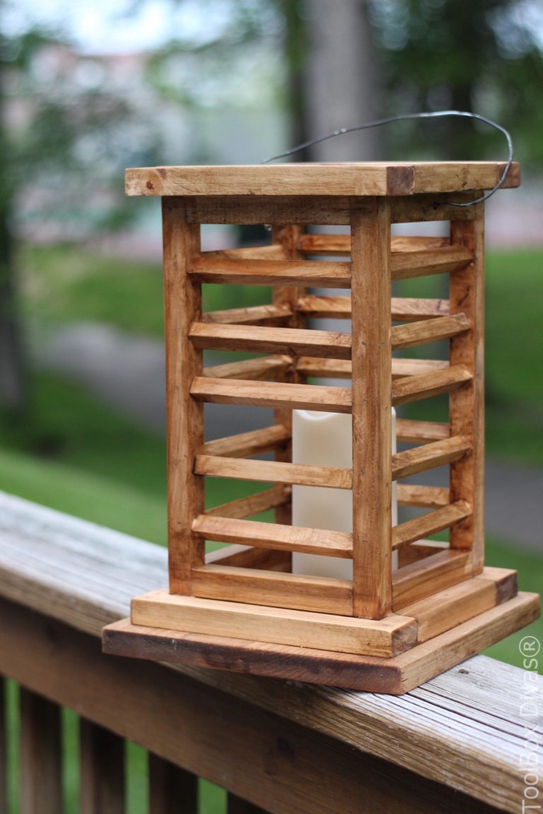 Wood slatted lantern on a deck rail